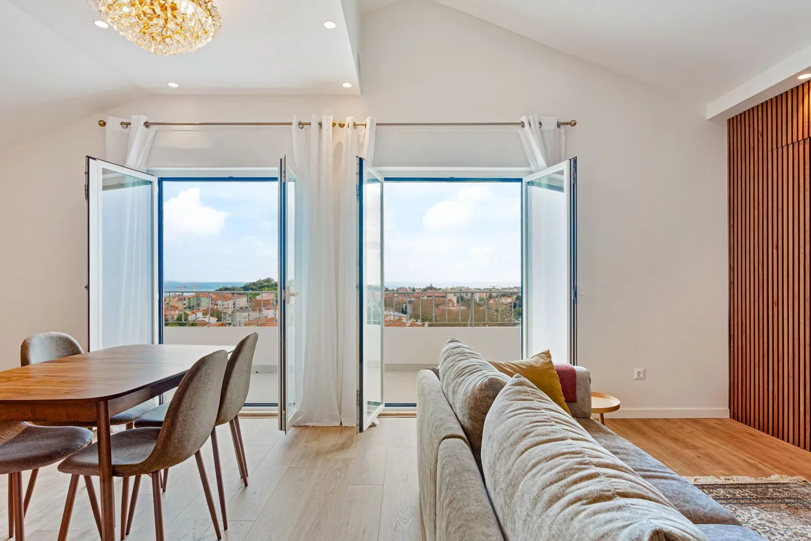 Living room with ocean view — Alvide renovation by Maya's Homes