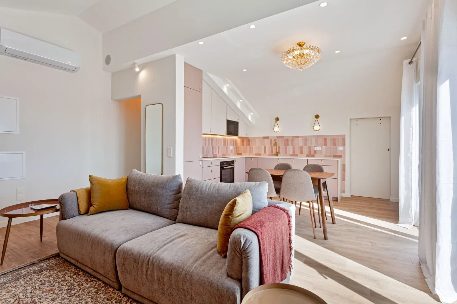 Kitchen opening to living room — Alvide renovation by Maya's Homes