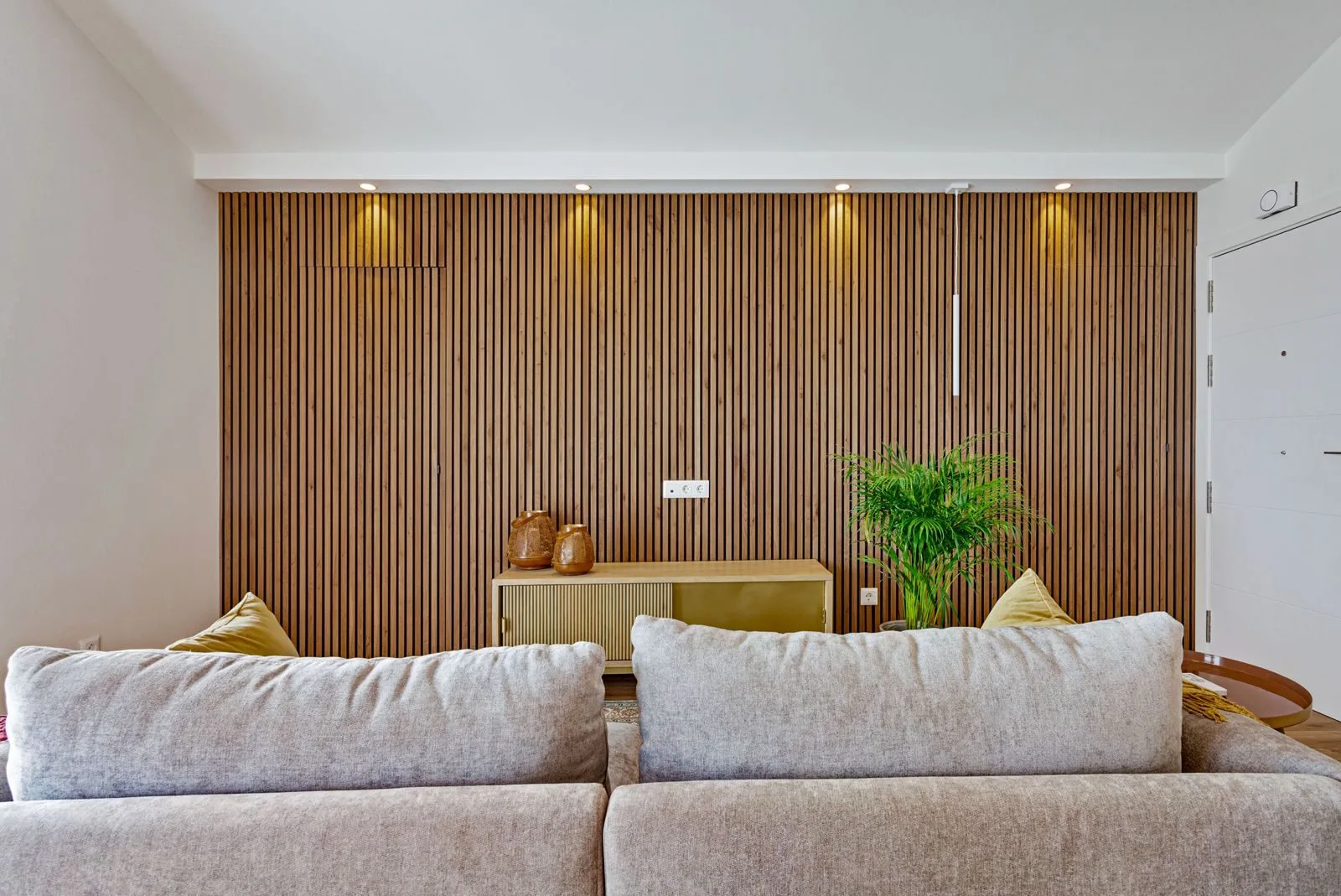 Wood slat detail — Alvide living room by Maya's Homes