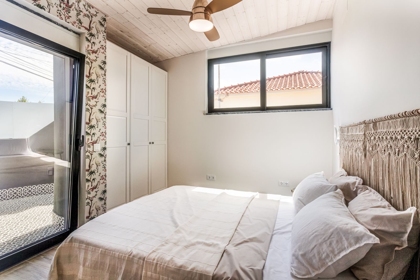 Guest bedroom with botanical wallpaper