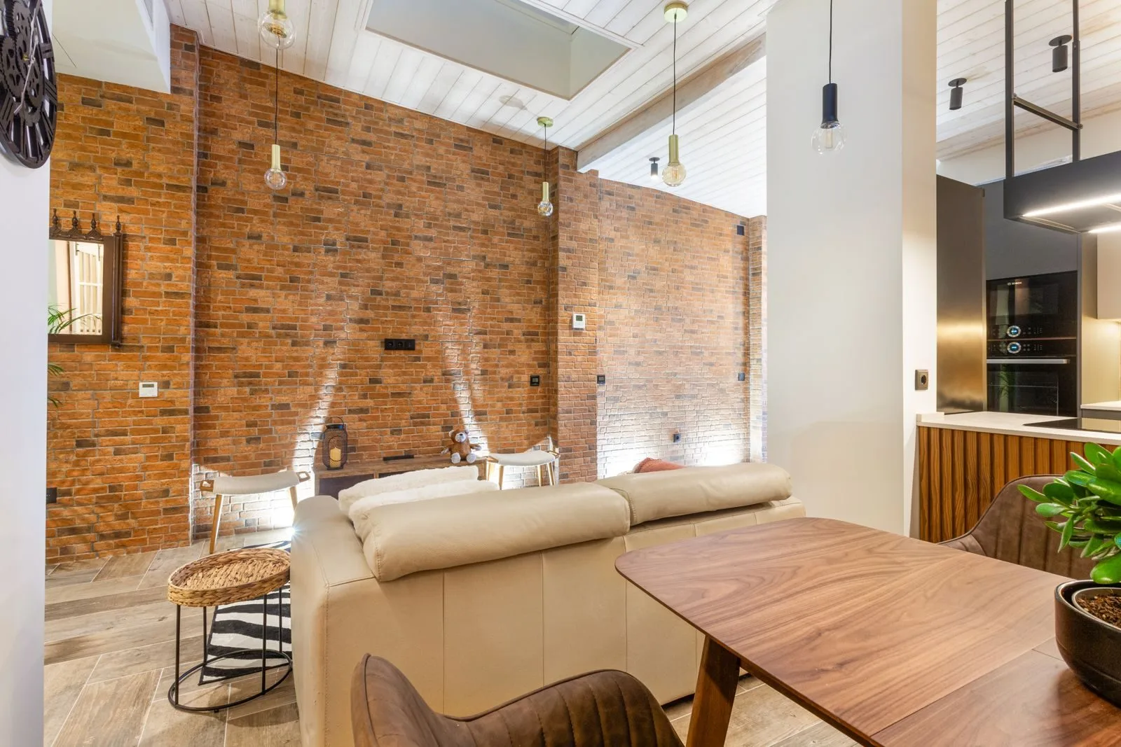 Exposed brick wall — Amoreira loft by Maya's Homes