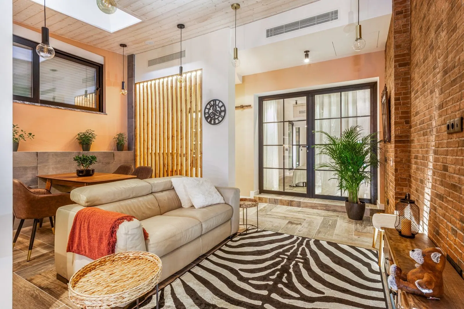 Open-plan living area — Amoreira loft conversion by Maya's Homes