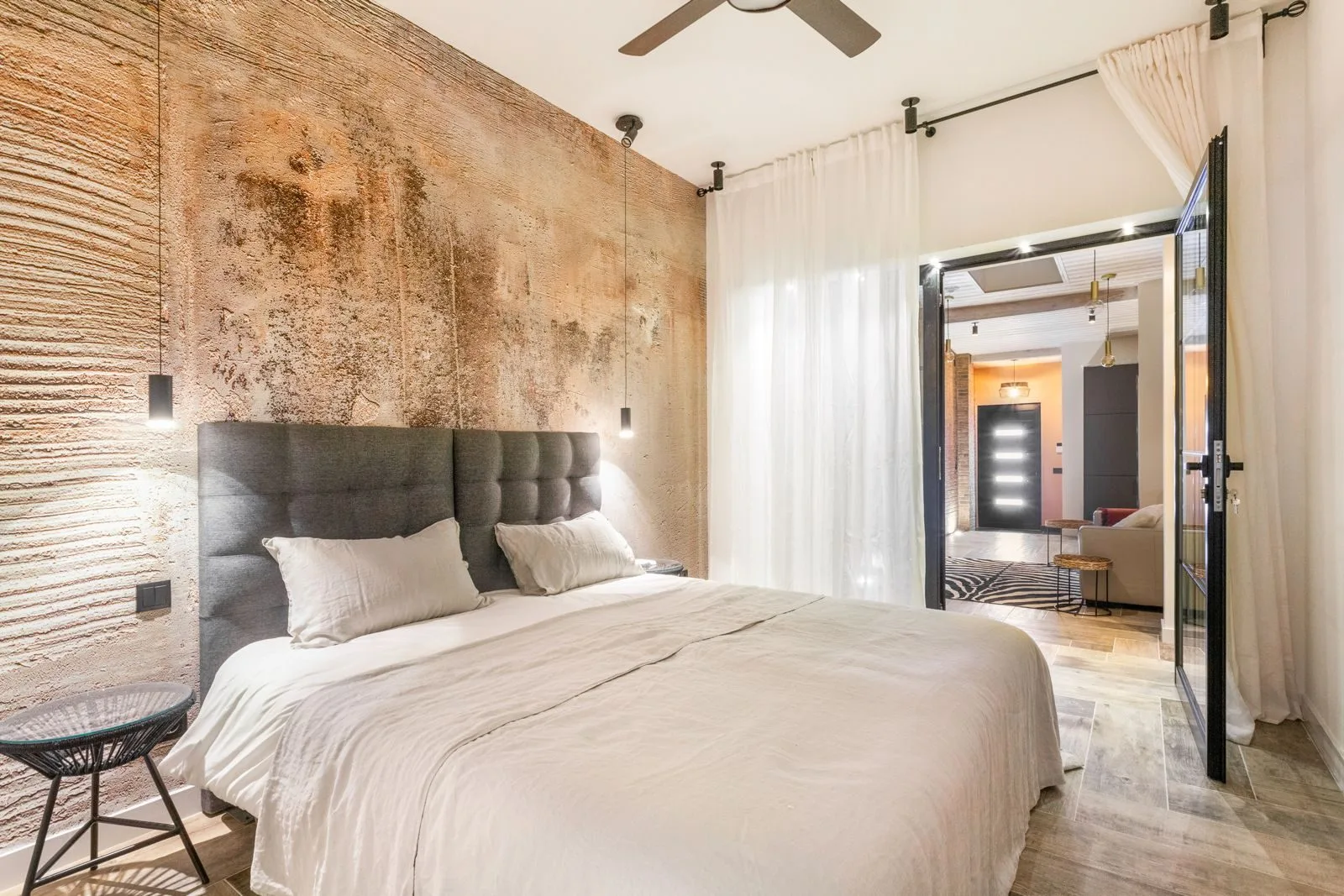 Master bedroom with glass doors — Amoreira loft by Maya's Homes