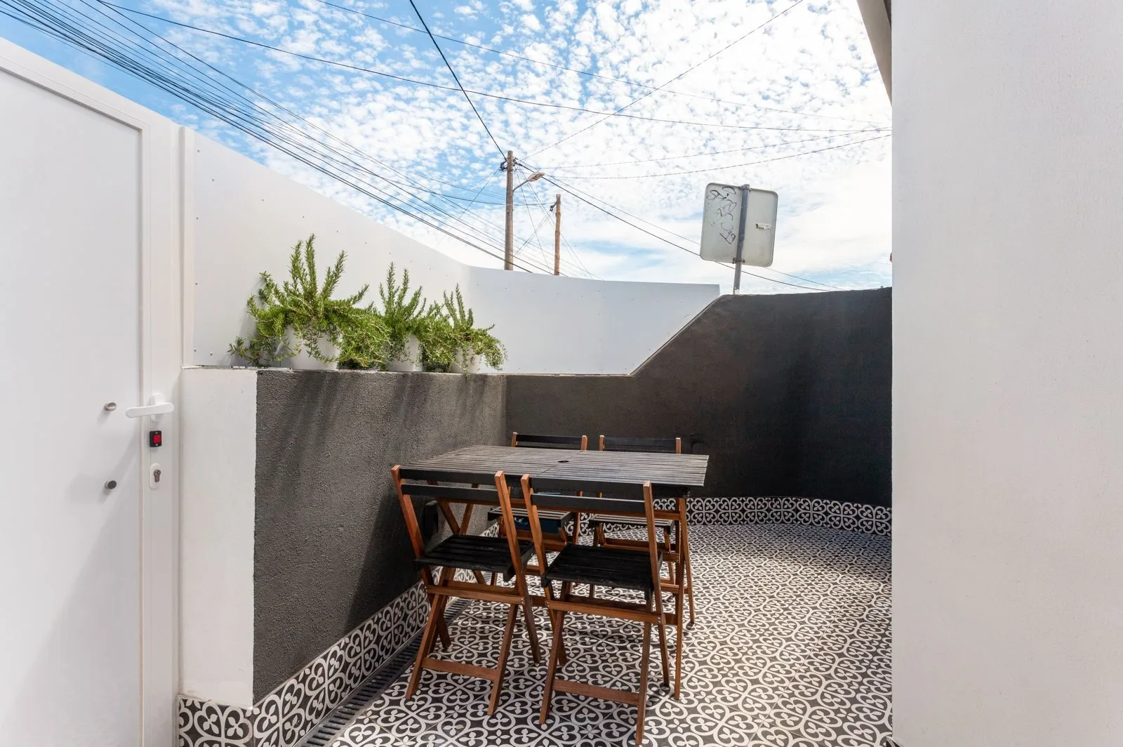 Private terrace with geometric tiles — Amoreira loft by Maya's Homes