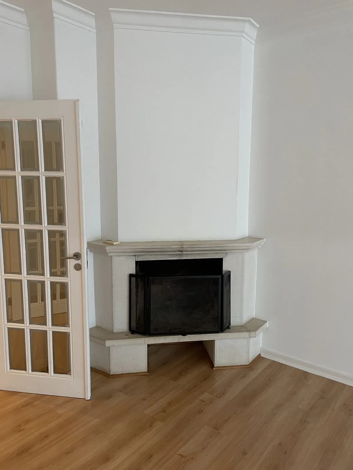 Before — fireplace area in Parede apartment