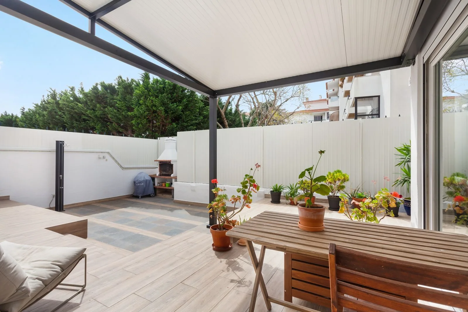 BBQ and outdoor dining area — Parede terrace by Maya's Homes