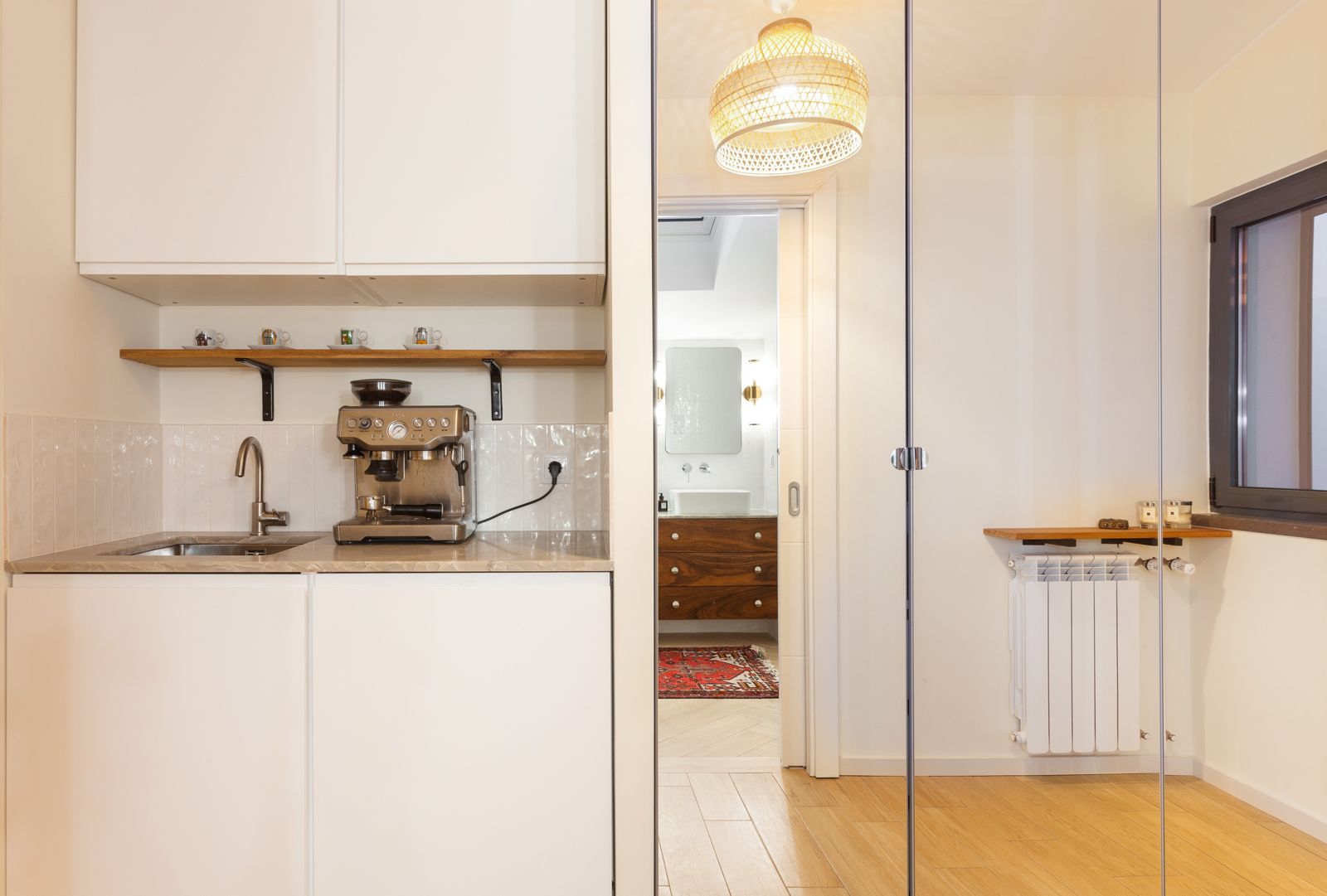 Coffee station with bathroom glimpse
