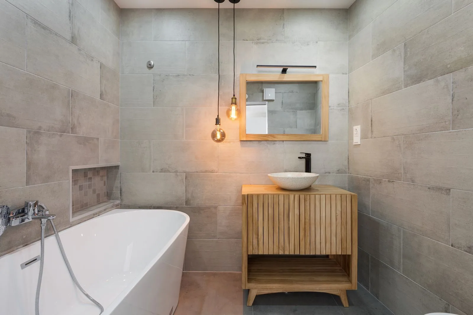 En-suite with freestanding bathtub — Figueiras renovation by Maya's Homes
